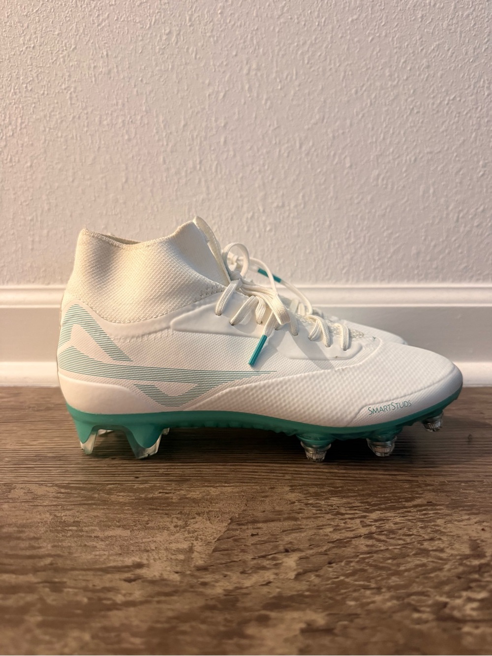 White and Teal Football Cleats